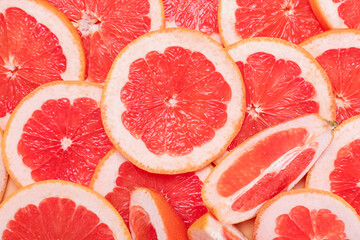 Fresh sliced grapefruit as background