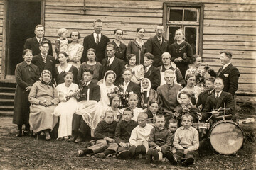 RUSSIA - CIRCA 1920s: Vintage photo shows newlyweds, bridesmaids, bridesmen and other wedding guests. Archive black and white photography.