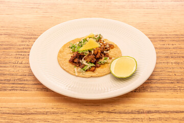 Image of delicious mexican taco on wooden table