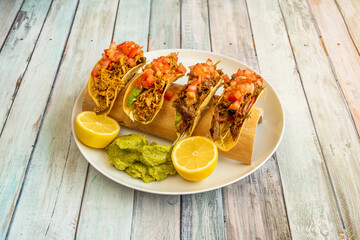 Image of delicious mexican taco on wooden table