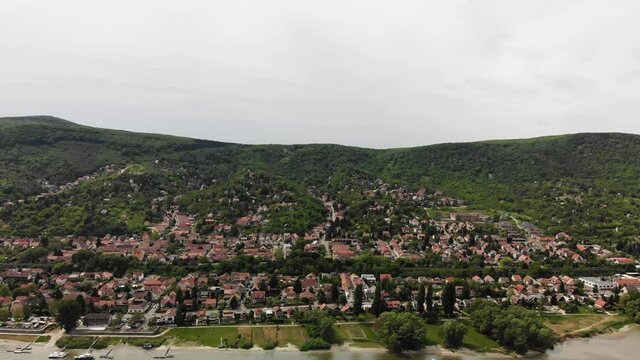 Nagymaros, Hungary. Drone Aerial View of Small City on Riverbank of Danube River
