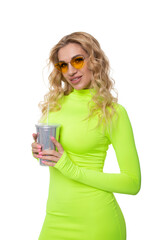 Obraz premium Portrait of a sexy blonde in a lemon-colored dress with a bright glass for a cocktail