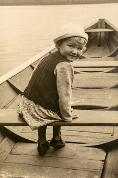 Latvia - CIRCA 1930s: Portrait of girl in the boat. Vintage archive Art Deco era photography