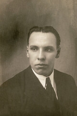 Germany - CIRCA 1930s: Man portrait close up in studio Vintage art deco era photo