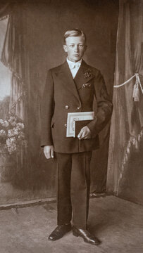 Germany - CIRCA 1920s: Man portrait standing in studio Vintage Carte de Viste art deco era college graduation photo