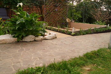 Road or path made of natural stone in the garden. Landscaping and decoration of garden.	