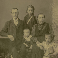 Russia - CIRCA 1910s: A family studio shot of married couple with three children in studio. Vintage Carte de Viste Edwardian era photo