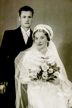 Latvia - CIRCA 1930s: Young married couple in studio. Vintage wedding art deco era photo