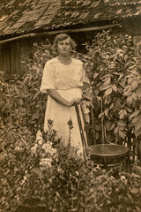 Latvia - CIRCA 1920s: Full body shot. Young women in garden. Vintage Carte de Viste Edwardian era photo