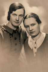 Latvia - CIRCA 1930s: Close up portrait of two woman in studio, Vintage Art Deco era photo