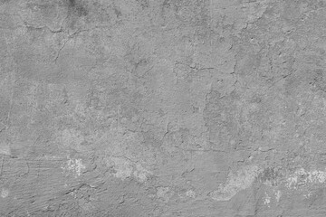 Texture of old gray concrete wall with cracks and attritions. Grunge cement background.