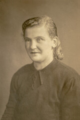 RUSSIA - CIRCA 1920s: Female portrait in studio Vintage Carte de Viste Edwardian era photo
