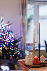 christmas candles on the table, christmas tree decorations, festive interior