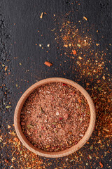 A set of peppers.Collage of different type pepper, Black ,white, pink and allspice peppercornsr, dried chili pepper.Top view. On a black background. free space for your text.