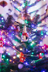 christmas tree decorations on blue background, a snowman toy