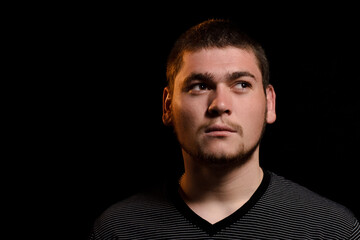 The man's gaze is directed to the side