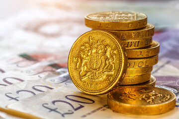 British coins stack on black, pound sterling,Business concept