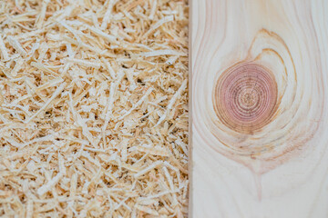 A row of scattered wood shavings in a carpenter's shop.