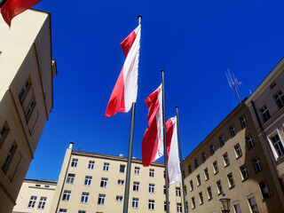 National flag of Poland on the cityscape
