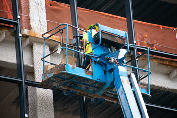 A construction worker on a lift