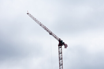 A construction crane with a sky background backdrop landscape view for a modern infrastructure and a industrial view on outdoor engineering 