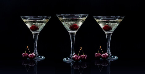 set of cherry martini in black background