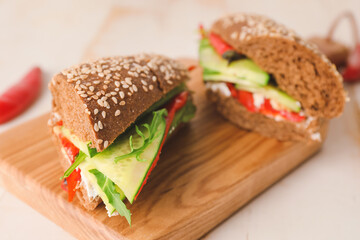 Tasty cucumber sandwiches on table