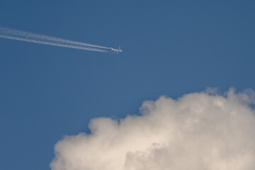 Airplane in the blue sky. Private jet.