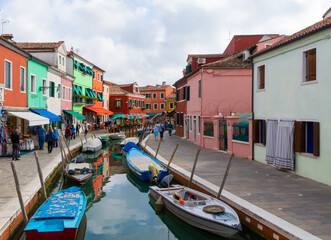 Fototapeta na wymiar One of Burano canals, with its typical colorful houses. Italy