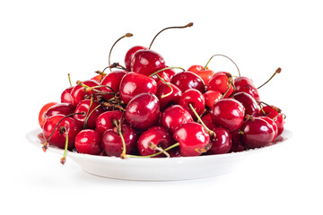 Sweet red cherry berries on a plate isolated on white background