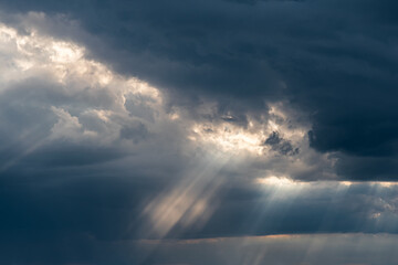 dramatic sky background - sun rays and clouds