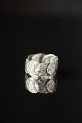 On a black background a silver ring
