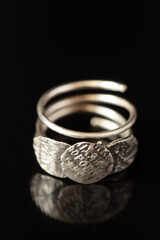 On a black background a silver ring
