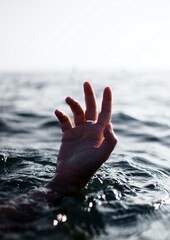 a human-hand off the water surface