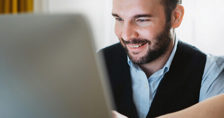 Fun bearded business man working at office, colleague discuss startup project, director looking in monitor computer, workplace teamwork concept