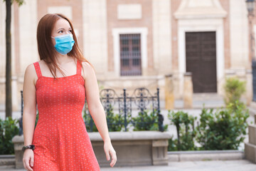 A girl wearing the mask to protect herself and others from the Covid 19 virus in Seville.