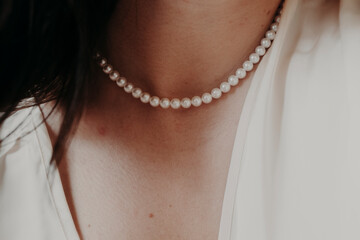 pearl necklace on a girl's neck