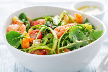 Summer salad with corn, shrimps and asparagus