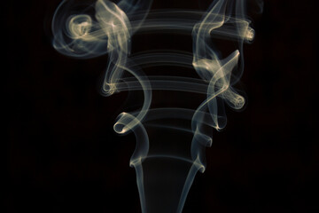 yellow smoke on black background