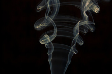yellow smoke on black background