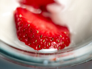 Slices of ripe tasty juicy strawberries in cream. Strawberries in sour cream. Tasty breakfast....