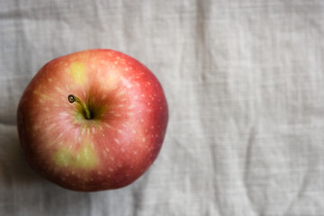 red apples on fabric background