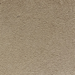 beige painted plaster wall close up, textured background