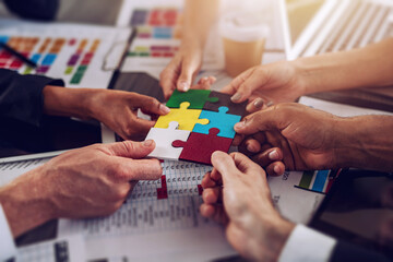 Teamwork of partners. Concept of integration and startup with puzzle pieces