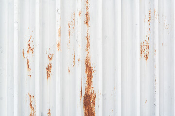 Red spots of rust on the white metal texture construction copy space for text title abstract
