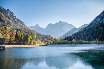 Calm day at Lake Jasna with Triglav mountains in the background in Slovenia