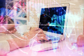 Double exposure of woman hands typing on computer and business theme hologram drawing. Success concept.