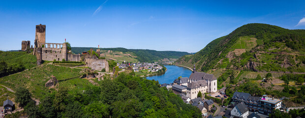With the bike on the cycle path through the countryside along the river Moselle in...