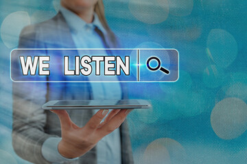 Text sign showing We Listen. Business photo text an organization willing to pay attention by...