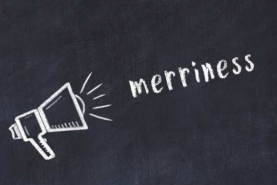 Chalk loudspeaker and inscription merriness on black chalkboard